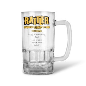 May include: A clear glass beer mug with a handle. The mug features the text "RATTLER CORNISH CLOUDY CYDER ORIGINAL". Below the logo is the text "Happy 40th Birthday Dad Lots of Love Jake & Alfie XxXxX".