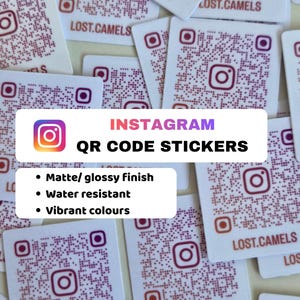 May include: A collection of square white stickers featuring a purple and orange Instagram logo and a QR code. Each sticker displays the text LOST.CAMELS at the bottom. The stickers are arranged in a scattered pile, showcasing the branding design.