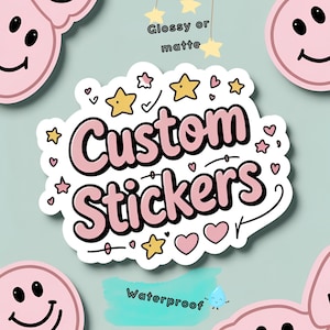 May include: A pink and black custom sticker design with the words "Custom Stickers" surrounded by stars and hearts. The sticker is labelled "Waterproof" and the text "Glossy or matte" is also present.