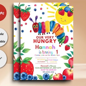 May include: A colorful invitation for a first birthday party featuring a cartoon caterpillar with a rainbow body and the words "Our Very Hungry Hannah is turning 1". The invitation has a white background with a yellow sun, red strawberries, and blue blueberries.