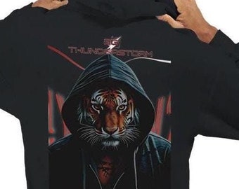 May include: Black hooded sweatshirt with a graphic print of a tiger wearing a black hooded sweatshirt. The text "5G THUNDERSTORM" is printed on the back of the sweatshirt.