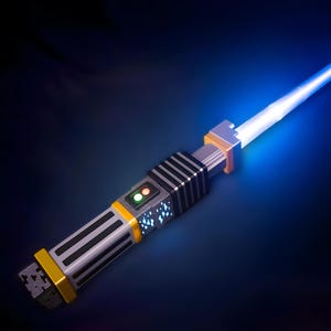 May include: A blue lightsaber with a yellow and grey handle. The lightsaber is switched on and emitting a blue beam of light.