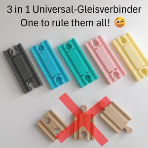 Könnte beinhalten: Sechs verschiedene farbige Kunststoff-Gleisverbinder für Spielzeugeisenbahnen. Die Verbinder sind so konzipiert, dass sie zu mehreren Marken von Eisenbahnstrecken passen. Der Text "3 in 1 Universal-Gleisverbinder One to rule them all!" steht über den Verbindern.
