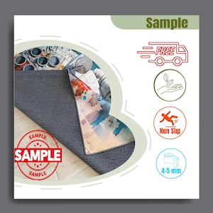 May include: A round rug with a blue and white patterned underside and a colorful top design. The top design features a watercolor-style image with a spaceship theme. The rug has a non-slip feature and is 4-5 mm thick. The word "Sample" is printed on the rug.