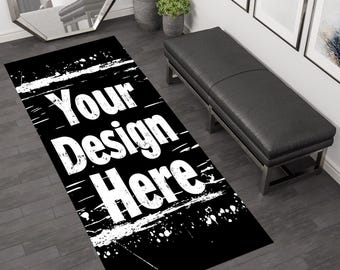 Puede incluir: Alfombra de pasillo negra y blanca con un diseño desgastado y salpicado de pintura. La alfombra tiene el texto "Your Design Here" en letras blancas.