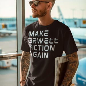 Make Orwell Fiction Again T-Shirt, Dystopian Softstyle Tee, Casual Wear, Thought-Provoking Gift, Literary Humor Shirt, Alternative Fashion