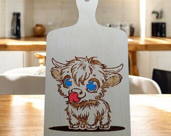 Beautiful Highland cow on wooden paddle. Done with pyrography and acrylic pens.