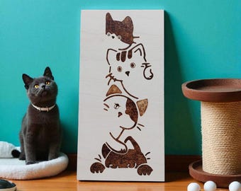 Pinewood panel featuring four cats peering out. Burned by hand using pyrography.