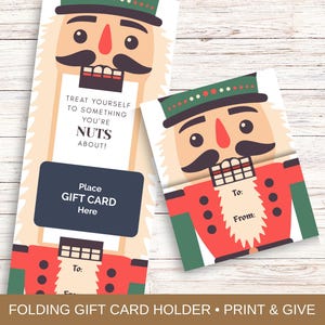 Puede incluir: Tarjetas de regalo con temática de Cascanueces. Una está doblada, la otra abierta, ambas con un diseño de Cascanueces de dibujos animados con abrigo rojo, sombrero verde y bigote negro. El texto incluye "Treat yourself to something you're nuts about!" y "Place GIFT CARD Here."