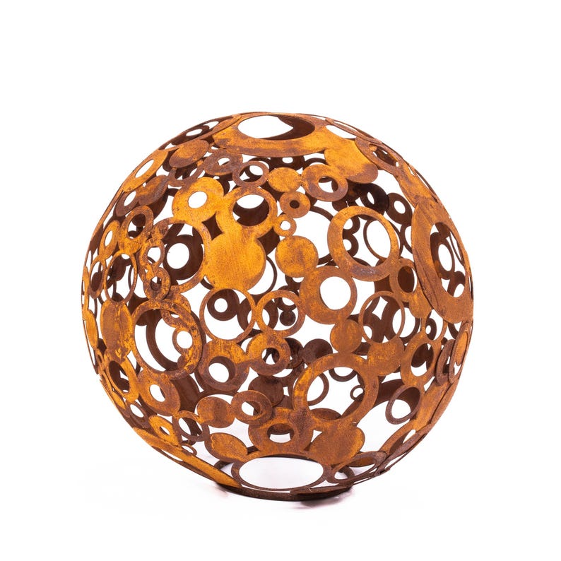 May include: A spherical, decorative metal sculpture with a rusted, orange-brown finish. The sphere is constructed from interconnected circles of varying sizes, creating an open design. Suitable for outdoor or indoor decor.