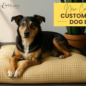 May include: A dog rests on a yellow plaid dog bed. The dog has black and brown fur. The bed is rectangular and has a yellow plaid pattern. Text in the image reads "New Collection Customized Dog Beds."
