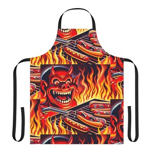 May include: A red and black apron with a cartoon devil grilling hot dogs over a fiery grill. The apron is covered in a repeating pattern of the devil, hot dogs, and flames.
