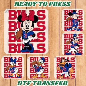 May include: DTF transfer sheets featuring Disney characters in Buffalo Bills football uniforms. Minnie Mouse, Mickey Mouse, Donald Duck, Daisy Duck, and Goofy are depicted with footballs. The text "READY TO PRESS" and "DTF TRANSFER" are included.