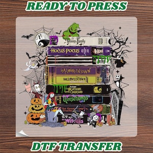 May include: A DTF transfer sheet featuring a stack of VHS tapes with titles including The Addams Family, Hocus Pocus, Halloweentown, The Nightmare Before Christmas, Goosebumps, and The Witches, surrounded by Halloween-themed illustrations like pumpkins.