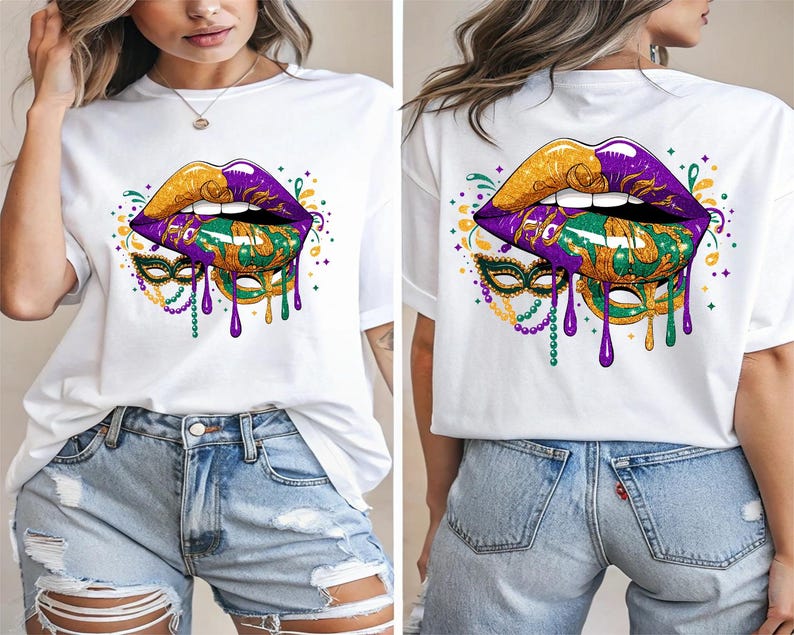 May include: White t-shirt featuring a vibrant graphic of stylized lips in gold and purple, with a green and gold mask design. The design includes dripping purple accents and decorative elements, creating a festive look.