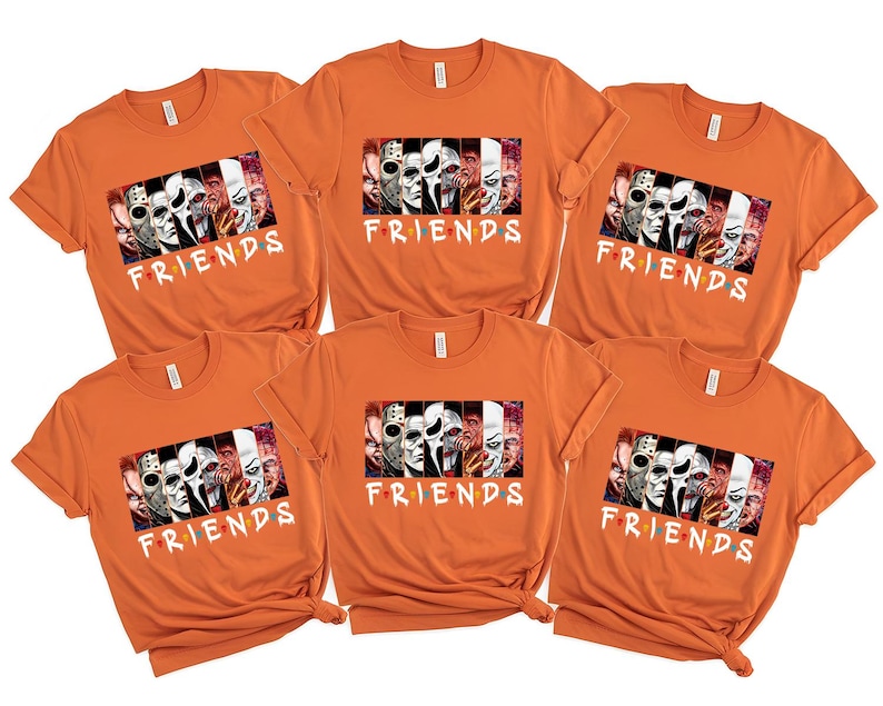 May include: Six orange t-shirts with a graphic featuring horror movie characters and the word "FRIENDS" in white. The graphic includes images of various masked figures and faces from horror films.