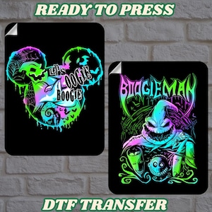 May include: Two black DTF transfer sheets with vibrant neon graphics. One shows a Mickey Mouse head with the text "Let's Oogie Boogie." The other features the Boogie Man character. The text "READY TO PRESS" and "DTF TRANSFER" are also present.