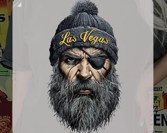 May include: A ready-to-press iron-on transfer featuring a cartoon illustration of a bearded man wearing a black beanie with a pom-pom and an eye patch. The beanie has the text "Las Vegas" in yellow lettering. The transfer is labeled "DTF Transfer".