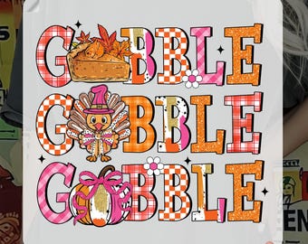 May include: A DTF transfer with the words "GOBBLE GOBBLE GOBBLE" in a layered design. Each word has a different pattern and is accompanied by Thanksgiving-themed graphics, including a pie, turkey, and pumpkin. The text "READY TO PRESS" and "DTF TRANSFER" are also included.