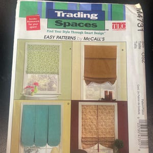 May include: A sewing pattern envelope for Trading Spaces by McCall's, model M4731. The front displays four window treatment designs labeled A, B, C, and D, featuring various fabric patterns and styles, including green swirls, solid brown, solid teal, and floral prints.