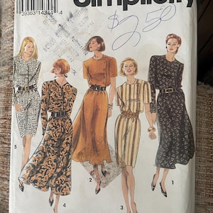 May include: Simplicity sewing pattern featuring five vintage dress designs. The pattern includes sizes PP (12-18). The cover art showcases illustrations of the dresses in various styles, including a striped dress and a dress with a floral pattern.