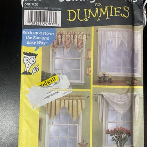 May include: A sewing pattern packet for window curtains. The packet features illustrations of different curtain styles, with the text "Sewing Patterns for Dummies" and "Stitch up a storm the Fun and Easy Way". The packet is yellow and has a barcode.
