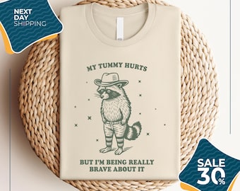 My Tummy Hurts But I'm Being Really Brave About It Vintage Shirt | Funny Raccoon T Shirt | Cowboy Raccoon Meme Tee | Bandit Raccoon