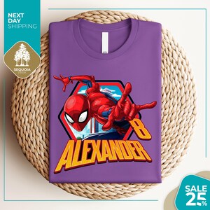 a purple t - shirt with a spiderman graphic on it