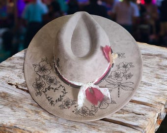 THE CAROLINA  is a fun summer festival hat. She is vegan suede wide brim hat that has been hand burned with a pyrography tool.