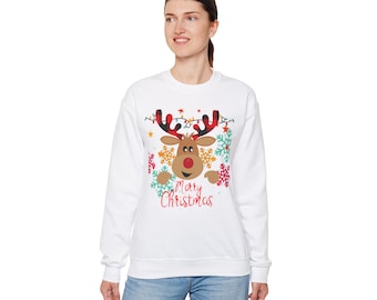 May include: White sweatshirt with a festive reindeer design. The reindeer has red antlers, a red nose, and is surrounded by snowflakes and lights. The text "Merry Christmas" is printed below the reindeer.