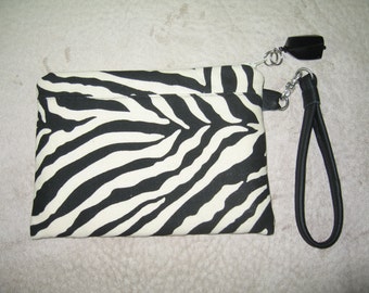 Zebra print wrist let with black leather wrist strap