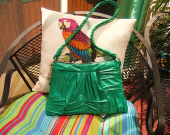 green purse shoulder style..very unique...with braided strap and charms..Ayla is enchanting.....