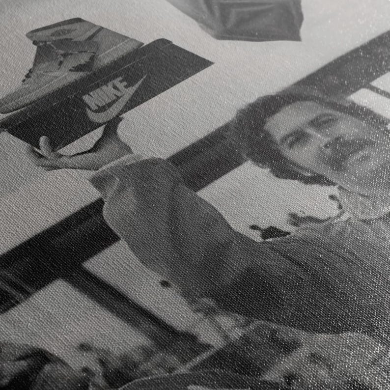 May include: Monochrome image of a Nike shoe box with a trainer on top. The Nike logo is visible on the box. The image is a close-up of the box and shoe.