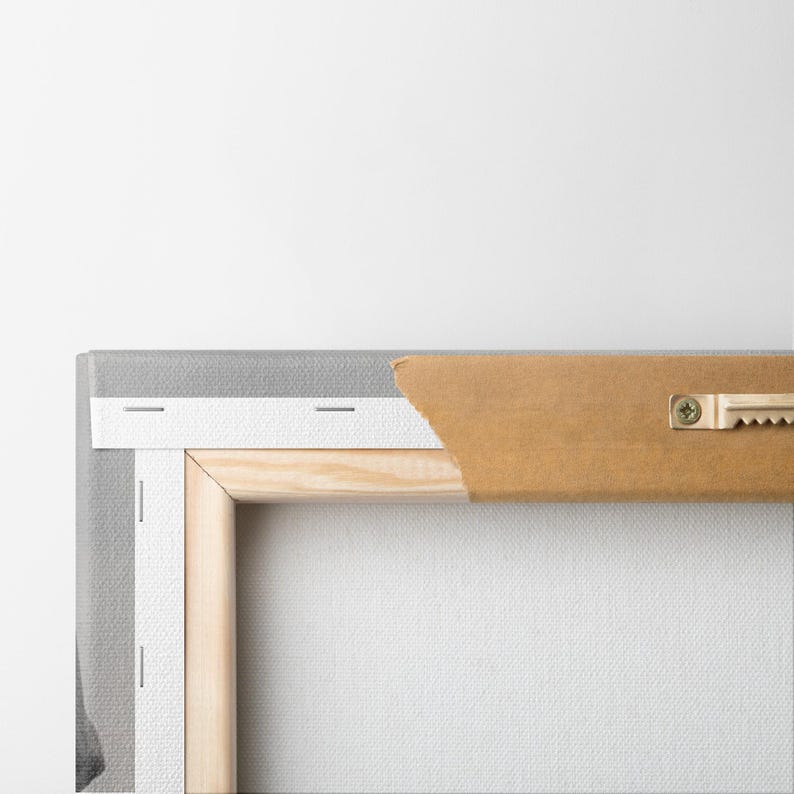 May include: Rear view of a stretched canvas art print. The canvas is wrapped around a wooden frame and stapled to the back. A brown paper backing is partially torn, revealing the frame. A metal sawtooth hanger is attached.