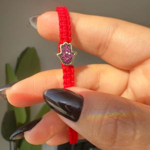 Red Thread Bracelet with Braided Design and Hamsa Pendant Featuring Pink and Red Sparkling Stones spiritual gift for her