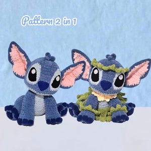 May include: Two blue crochet plush toys featuring large ears with pink inner sections, dark blue noses, and white chest patches. One plush is plain, while the other wears a green leafy collar and skirt. The text Pattern 2 in 1 is visible above.