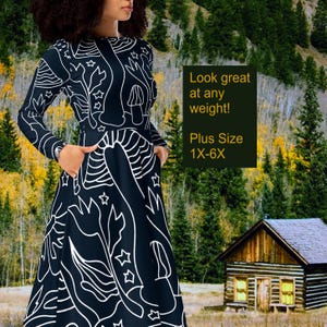 May include: A black long-sleeved dress with a white abstract design featuring stars, mushrooms, and other organic shapes. The dress has a fitted bodice and a flowing skirt. The text "Look great at any weight! Plus Size 1X-6X" is visible in the image.