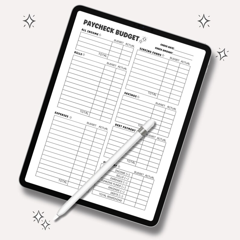 May include: A digital tablet displaying a "Paycheck Budget" template, with sections for income, bills, expenses, and savings. A white stylus rests on the screen. The template includes fields for budget and actual amounts.