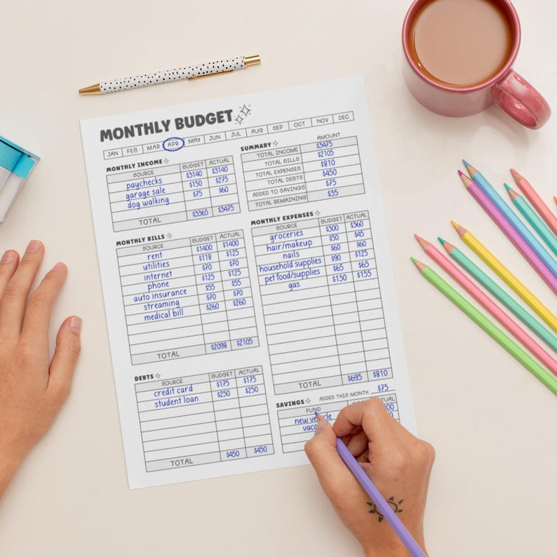 May include: A printable monthly budget worksheet with sections for income, bills, expenses, debts, and savings. The worksheet includes columns for budget and actual amounts. The worksheet is filled out with handwritten numbers.