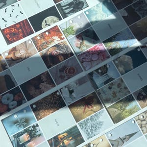 May include: A collection of seasonal themed tags, each featuring a different image. The tags are arranged in rows and columns, with text labels such as "Halloween", "Fall", "Winter", and "Spring". The images include pumpkins, candles, and nature scenes.