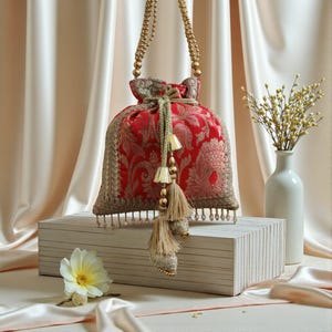Ethnic Red Brocade fabric Top Handle Bag with Traditional Indian design and Fringes for Cultural Wedding and Royal events - CLIO
