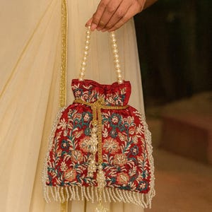 Red Tassel Potli Bag with Pearl Fringes, Heavy Drawstring and fine Floral Embroidery for Exotic wedding accessory - INAYA