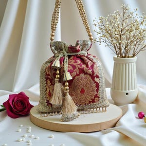 CLIO Ethnic Wine Brocade fabric Top Handle Bag with Traditional French design and Fringes for Cultural Wedding and Royal events