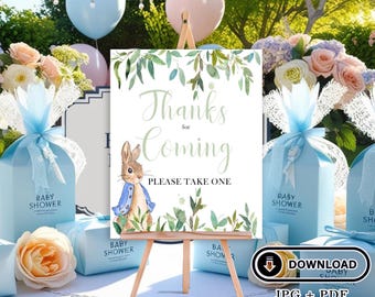 May include: A baby shower favor sign with a watercolor illustration of a rabbit in a blue jacket and green leaves. The sign says "Thanks for Coming" and "Please Take One".