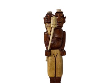 Agboran Ashikuelu. A warrior linked to a staff, he represents defense, strength, and implacable justice as the spiritual protector of the mountain.