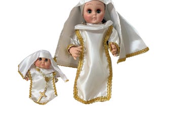 Handcrafted nun doll with a white and gold habit, inspired by the Yoruba religion and Afro-Cuban syncretism.