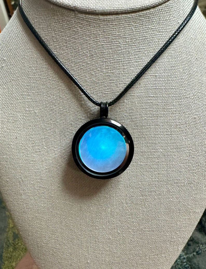 Floating Locket Light up Multicolored Lights in a Black