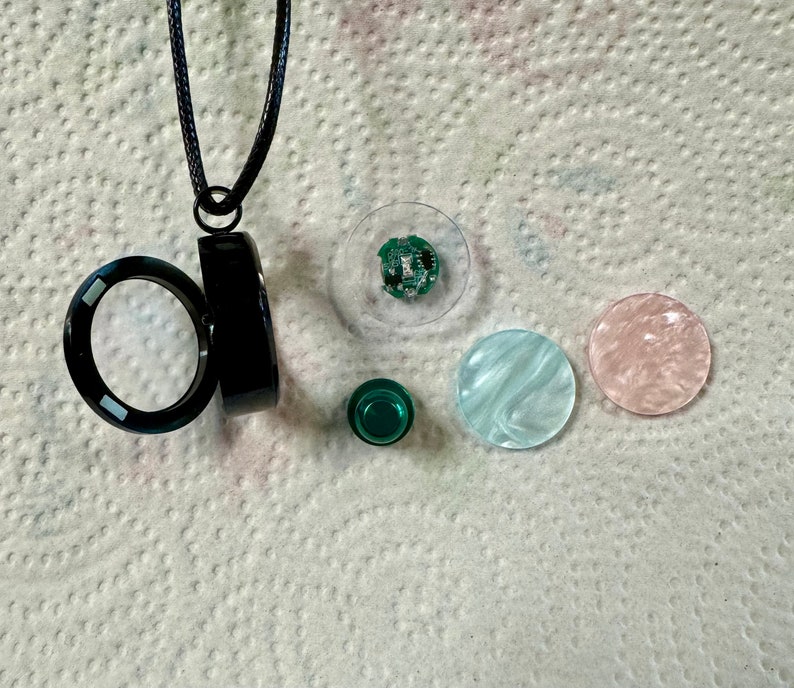 Floating Locket Light up Multicolored Lights in a Black