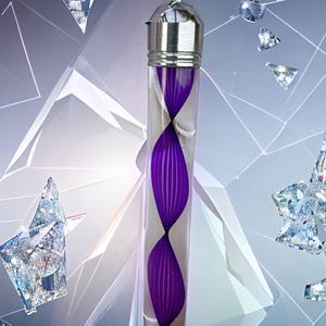 May include: A clear glass vial with a silver cap and a silver loop. Inside the vial is a purple, abstract design. The background features geometric shapes and floating diamond-like objects.