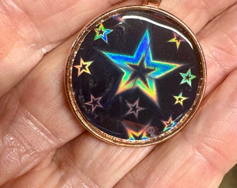 Holographic Superstar pendant in rose gold and black.